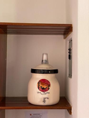 a pot sitting on a shelf in a wall at HOTEL UTZTZABA in Monterrico