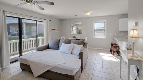 a living room with a couch and a kitchen at Beachwood Villas 2A in Santa Rosa Beach