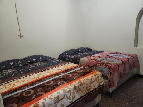 Cama o camas de una habitación en Hotel Canaan La aurora