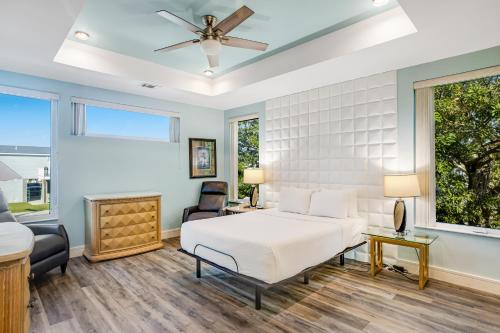 a bedroom with a white bed and a window at Big Pine Key Dreams in Big Pine Key