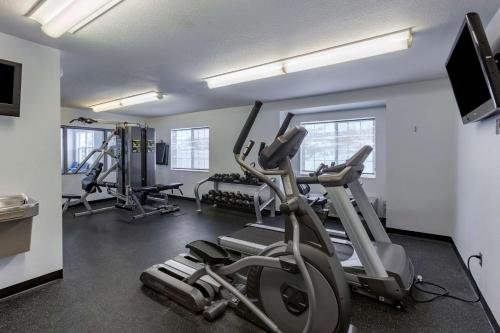 a gym with two treadmills and two ellipticals at Best Western Plus Woodstock Inn & Suites in Woodstock