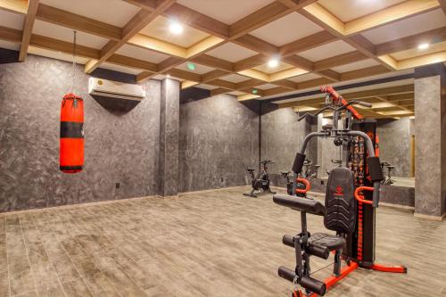 a room with a gym with a treadmill and a punching bag at Giada Towers A204 in Tulum
