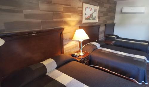 Ένα ή περισσότερα κρεβάτια σε δωμάτιο στο Hotel La Posta