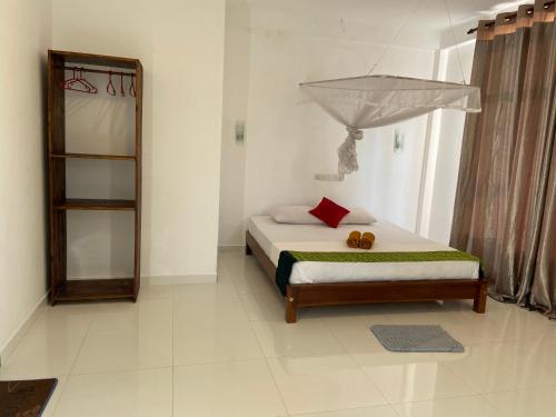 Ein Bett oder Betten in einem Zimmer der Unterkunft Manjari Villas Madiha