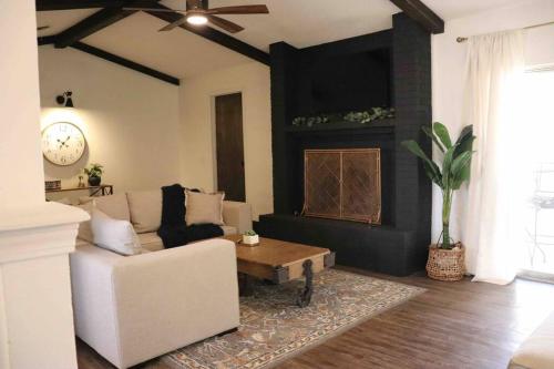 a living room with a couch and a coffee table at By HWY, 3/2 , sleeps large group Palo Duro Fun in Amarillo