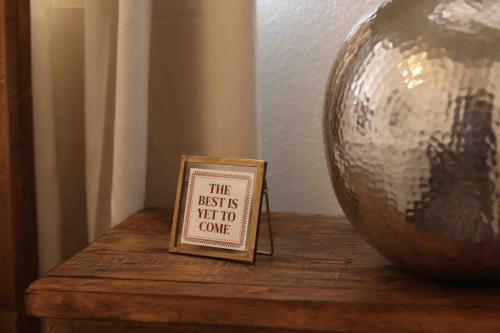 a small sign sitting on a table next to a ball at By HWY, 3/2 , sleeps large group Palo Duro Fun in Amarillo