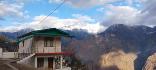 a small building on the side of a mountain at Shrikanth Homestay in Joshīmath