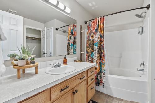 a bathroom with a sink and a shower at Southwestern Style 4 Bedroom Nampa Home Sleeps 16! in Nampa