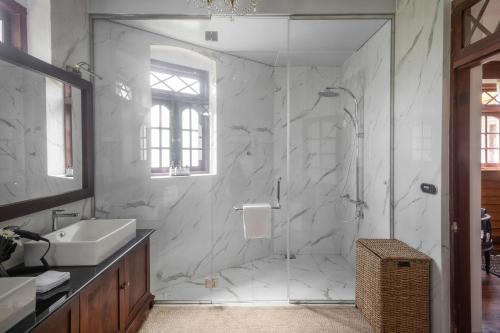 a bathroom with a shower and a sink at W15 Lake Gregory in Nuwara Eliya