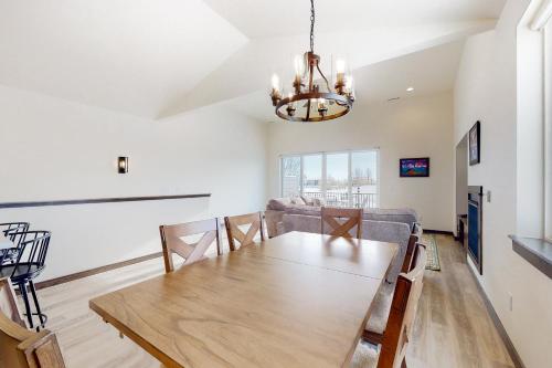 a dining room with a table and a couch at Spanish Peaks 1 in Belgrade