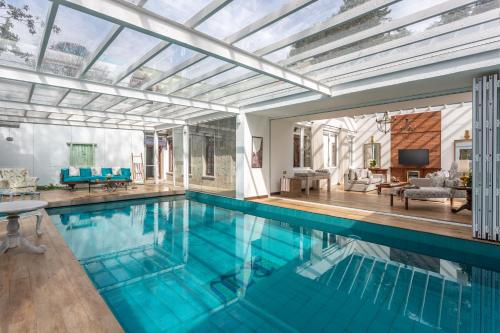 a swimming pool in a house with a glass ceiling at W15 Lake Gregory in Nuwara Eliya