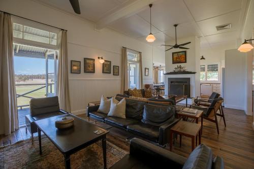 a living room with a couch and a fireplace at The Homestead at Corunna Station in Belford
