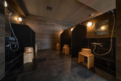 a bathroom with two sinks and two toilets at Hotel Shuranza MAKUHARI BAY in Chiba