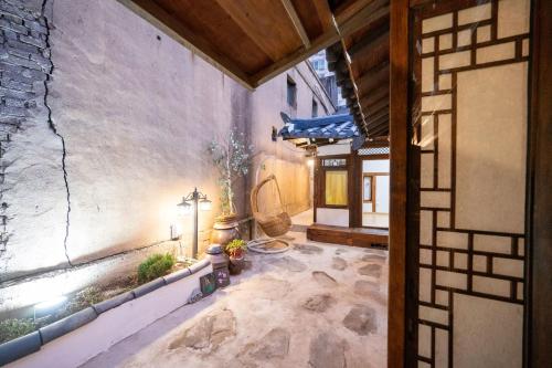 an outside view of a building with a courtyard at Hanok1942 in Daegu