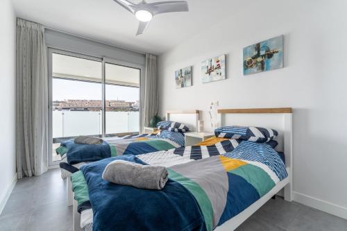 Posteľ alebo postele v izbe v ubytovaní 208 New luxury apartment Calaserena
