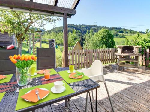 a patio with a table and chairs on a deck at Grub-Daniel-Hof in Freiamt