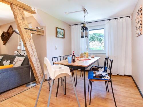 a dining room and living room with a table and chairs at Grub-Daniel-Hof in Freiamt