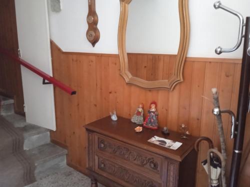 a table with a mirror and some figurines on it at IL SENTIERO in Pioraco