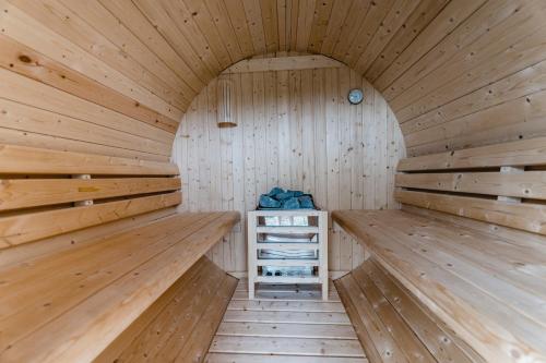a sauna with wooden walls and wooden floors at Landhotel Rügheim in Rügheim