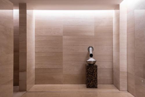 a shower in a bathroom with aaucet at EPIC SANA Lisboa Hotel in Lisbon