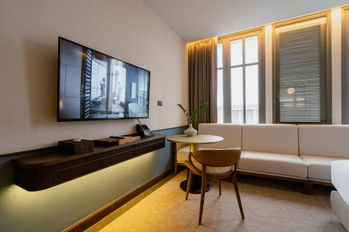 TV a/nebo společenská místnost v ubytování Hotel MOCO