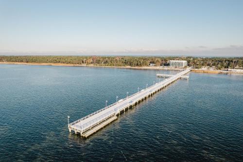 an aerial view of a dock in a body of water at BlueApart Verano Residence in Jurata
