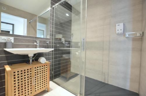 a bathroom with a sink and a shower at House 200m from Puerto de Sóller Beach in Port de Soller