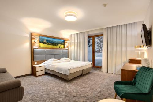 Posteľ alebo postele v izbe v ubytovaní Hotel Pegaz