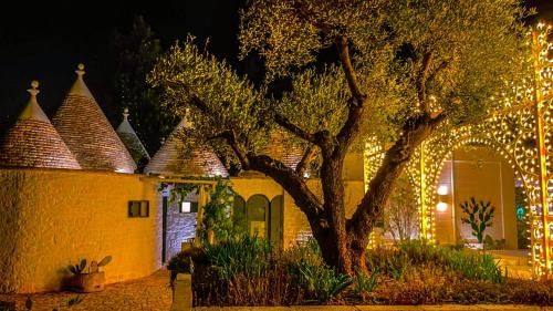 a house with christmas lights on it at night at Tenuta del Lauro in Locorotondo
