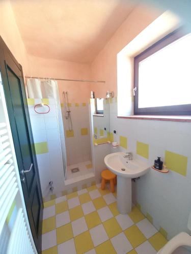 a bathroom with a sink and a shower at Azienda Agricola Il Querceto in Marsico Vetere