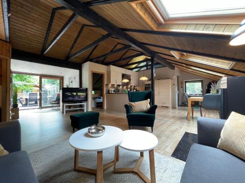 a living room with a couch and a table at Luett Huus in Gartow