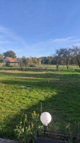 a white object in the middle of a field at Logement : 2 chambres (5 couchages), salle de bain in Pierrefitte-sur-Sauldre