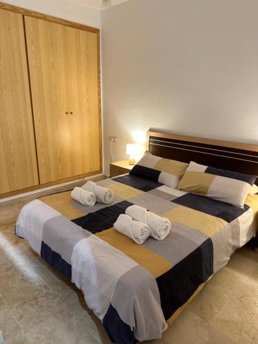 a bedroom with two beds with towels on them at Mijas Playa Retreat in La Cala de Mijas