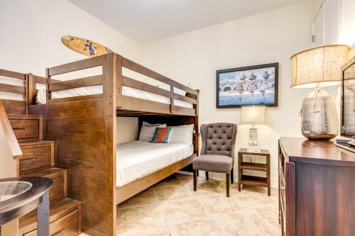 a bedroom with a bunk bed and a desk at Diamond Beach Resort Seawall Stunner in Galveston