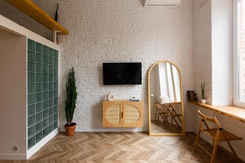 TV a/nebo společenská místnost v ubytování Passage Apartment