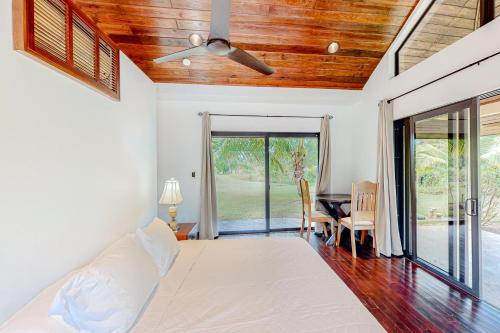 a bedroom with a bed and a table and chairs at Zumba House at The Reserve Gold Standard Certified in Hopkins