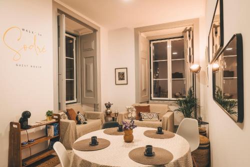 a living room with two tables and a couch at Walk'in Sodré in Lisbon