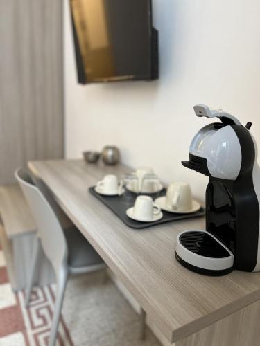 a coffee maker sitting on top of a wooden table at Bonadies64 B&B in Salerno