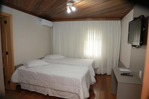 Ένα ή περισσότερα κρεβάτια σε δωμάτιο στο Letto Hotel Flores da Cunha