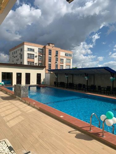 a large swimming pool on top of a building at De Silver Green Luxury Hotel in Abuja