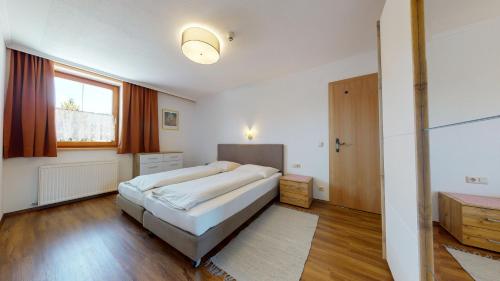 Cama o camas de una habitación en Appartements KALSWIRT