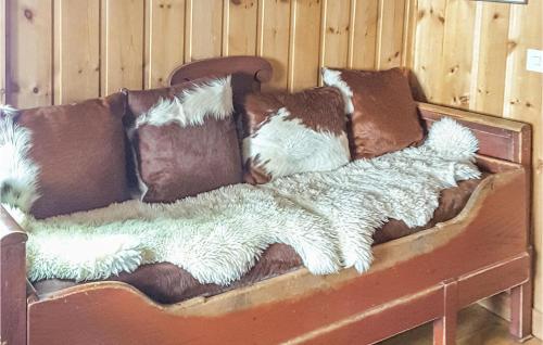 a couch with pillows on it in a room at Lovely Home In Vemdalen With Sauna in Vemdalen