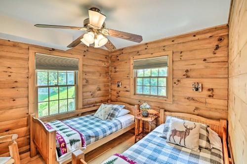a bedroom with two beds and a ceiling fan at Lakefront Athens Getaway with Game Room and Deck! in Athens