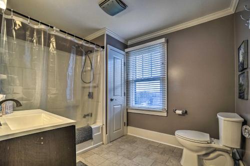 a bathroom with a toilet and a shower and a sink at Charming and Family-Friendly Zanesville Home! in Zanesville