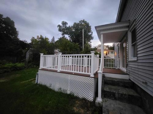 a porch with a white railing on a house at Newly updated 3 bedrooms luxury house in Worcester