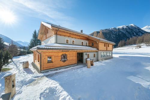 a log cabin in the snow in the mountains at Engadin Chalet - Private Spa Retreat & Appart -St Moritz - Val Bever in Bever