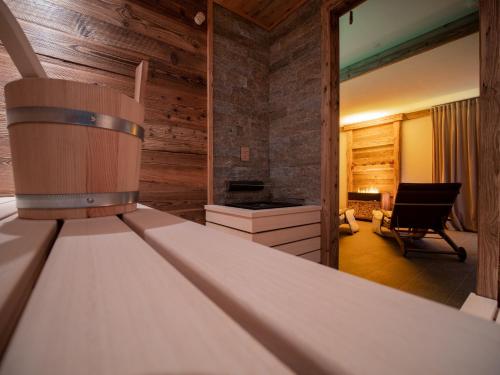 a room with a bed and a living room at Engadin Chalet - Private Spa Retreat & Appart -St Moritz - Val Bever in Bever