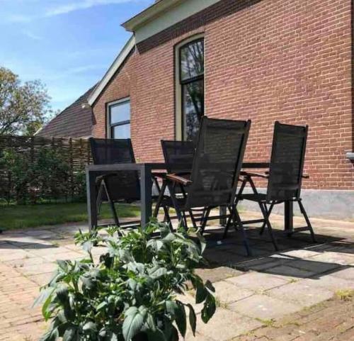 Κήπος έξω από το Statige boerderijwoning met vrij uitzicht en tuin
