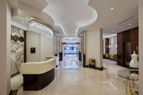a lobby of a hotel with a reception desk at Gladiolus Hotel in Jeddah