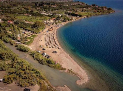 an aerial view of a beach with tents and the water at Countryside luxury studios in Káto Lekhónia